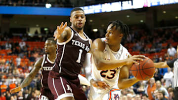 Mar 4, 2020; Auburn, Alabama, USA; Texas A&M Aggies guard Savion Flagg (1) pressures Auburn Tigers forward Issac Okoro (23) during the second half at Auburn Arena. Mandatory Credit: John Reed-USA TODAY Sports
