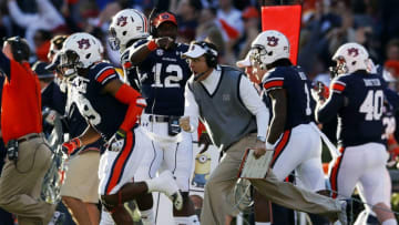AUBURN, AL - NOVEMBER 30: Head coach Gus Malzahn celebrates a first quarter touchdown by Nick Marshall #14 of the Auburn Tigers against the Alabama Crimson Tide at Jordan-Hare Stadium on November 30, 2013 in Auburn, Alabama. (Photo by Kevin C. Cox/Getty Images)