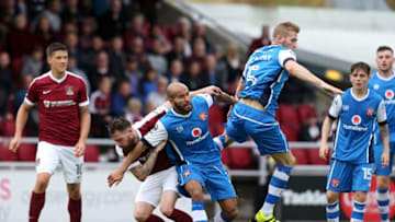 NORTHAMPTON, ENGLAND - SEPTEMBER 10: Adam Chambers and Jason McCarthy of Walsall contest the ball with Paul Anderson of Northampton Town during the Sky Bet League One match between Northampton Town and Walsall at Sixfields on September 10, 2016 in Northampton, England. (Photo by Pete Norton/Getty Images)