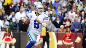 Dec 8, 2013; Landover, MD, USA; Dallas Cowboys quarterback Tony Romo (9) scrambles against the Washington Redskins during the second half at FedEx Field. Mandatory Credit: Brad Mills-USA TODAY Sports