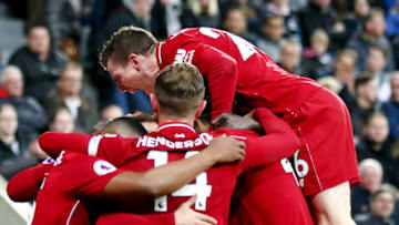 NEWCASTLE UPON TYNE, ENGLAND - MAY 04: Divock Origi of Liverpool celebrates with teammates after scoring his team's third goal during the Premier League match between Newcastle United and Liverpool FC at St. James Park on May 04, 2019 in Newcastle upon Tyne, United Kingdom. (Photo by Clive Brunskill/Getty Images)