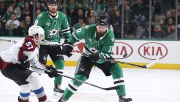 DALLAS, TX - JANUARY 13: Martin Hanzal #10 of the Dallas Stars handles the puck against Gabriel Bourque #57 of the Colorado Avalanche at the American Airlines Center on January 13, 2018 in Dallas, Texas. (Photo by Glenn James/NHLI via Getty Images)