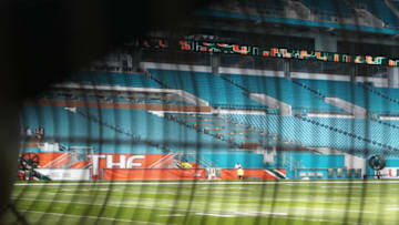 A look through a fan at Hard Rock Stadium as the field crew preps for a Sunday game - image by Brian Miller