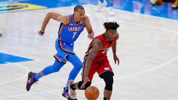Heat forward Jimmy Butler (22) dribbles the ball ahead of OKC Thunder forward Darius Bazley (7) : Alonzo Adams-USA TODAY Sports