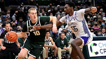 Dec 29, 2021; East Lansing, Michigan, USA; Michigan State Spartans forward Joey Hauser (10) dribbles the ball against High Point Panthers forward Zack Austin (55) in the second half at Jack Breslin Student Events Center. Mandatory Credit: Dale Young-USA TODAY Sports