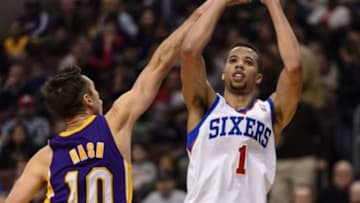 Feb 7, 2014; Philadelphia, PA, USA; Philadelphia 76ers guard Michael Carter-Williams (1) shoots under pressure from Los Angeles Lakers guard Steve Nash (10) during the third quarter at the Wells Fargo Center. The Lakers defeated the Sixers 112-98. Mandatory Credit: Howard Smith-USA TODAY Sports