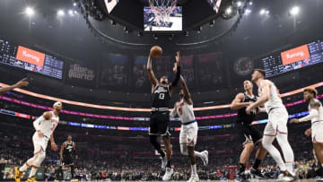 LOS ANGELES, CA - MARCH 11: Paul George #13 of the Los Angeles Clippers scores a basket against RJ Barrett #9 of the New York Knicks during the first half at Crypto.com Arena on March 11, 2023 in Los Angeles, California. NOTE TO USER: User expressly acknowledges and agrees that, by downloading and or using this photograph, User is consenting to the terms and conditions of the Getty Images License Agreement. (Photo by Kevork Djansezian/Getty Images)