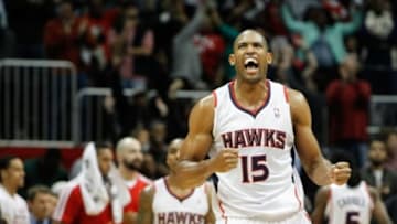 Nov 29, 2013; Atlanta, GA, USA; Atlanta Hawks center Al Horford (15) celebrates a victory against the Dallas Mavericks in the fourth quarter at Philips Arena. The Hawks defeated the Mavericks 88-87. Mandatory Credit: Brett Davis-USA TODAY Sports