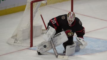 Jan 16, 2021; Ottawa, Ontario, CAN; Ottawa Senators goalie Matt Murray (30) makes a save in the third period against the Toronto Maple Leafs at the Canadian Tire Centre. Mandatory Credit: Marc DesRosiers-USA TODAY Sports