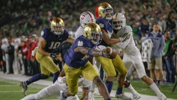 SOUTH BEND, IN - SEPTEMBER 29: Miles Boykin #81 of the Notre Dame Fighting Irish stretches for the touchdown as Malik Antoine #3 of the Stanford Cardinal tries to make the stop at Notre Dame Stadium on September 29, 2018 in South Bend, Indiana. (Photo by Michael Hickey/Getty Images)