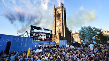 MANCHESTER, ENGLAND - MAY 20: General view as players celebrate on the stage and fans show their support during the Manchester City Teams Celebration Parade on May 20, 2019 in Manchester, England. (Photo by Nathan Stirk/Getty Images)