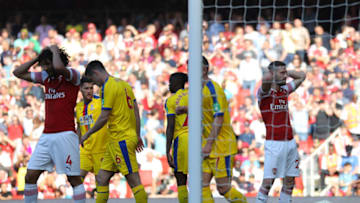 LONDON, ENGLAND - APRIL 21: Shkodran Mustafi (20) and Mohamed Elneny of Arsenal (4) react during the Premier League match between Arsenal FC and Crystal Palace at Emirates Stadium on April 21, 2019 in London, United Kingdom. (Photo by Warren Little/Getty Images)