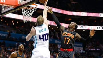 Nov 18, 2016; Charlotte, NC, USA; Charlotte Hornets forward Cody Zeller (40) goes up for a shot against Atlanta Hawks guard Dennis Schroder (17) in the first half at Spectrum Center. Mandatory Credit: Jeremy Brevard-USA TODAY Sports