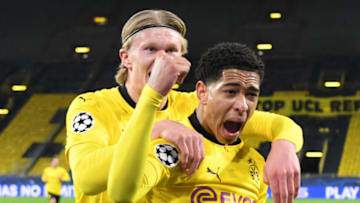 Dortmund's English midfielder Jude Bellingham (R) celebrates scoring the opening goal with his teammates including Dortmund's Norwegian forward Erling Braut Haaland during the UEFA Champions League quarter-final second leg football match between BVB Borussia Dortmund and Manchester City in Dortmund, western Germany, on April 14, 2021. (Photo by INA FASSBENDER / various sources / AFP) (Photo by INA FASSBENDER/AFP via Getty Images)