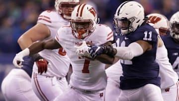 Dec 3, 2016; Indianapolis, IN, USA; Wisconsin Badgers running back Bradrick Shaw (7) runs against Penn State Nittany Lions linebacker Brandon Bell (11) in the first quarter during the Big Ten Championship game at Lucas Oil Stadium. Mandatory Credit: Mike De Sisti/Milwaukee Journal Sentinel via USA TODAY Sports