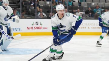 Nov 27, 2022; San Jose, California, USA; Vancouver Canucks defenseman Luke Schenn (2) skates with the puck against the San Jose Sharks during the second period at SAP Center at San Jose. Mandatory Credit: Darren Yamashita-USA TODAY Sports