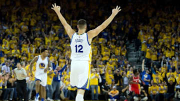Apr 27, 2016; Oakland, CA, USA; Golden State Warriors center Andrew Bogut (12) celebrates after forward Brandon Rush (4) scores a three point basket against the Houston Rockets during the second quarter in game five of the first round of the NBA Playoffs at Oracle Arena. Mandatory Credit: Kelley L Cox-USA TODAY Sports