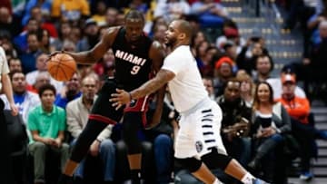 Jan 15, 2016; Denver, CO, USA; Denver Nuggets guard Jameer Nelson (1) guards Miami Heat forward Luol Deng (9) in the first quarter at the Pepsi Center. Mandatory Credit: Isaiah J. Downing-USA TODAY Sports