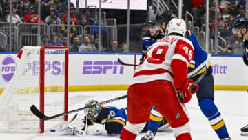 Dec 12, 2023; St. Louis, Missouri, USA; Detroit Red Wings right wing Jonatan Berggren (48) scores against St. Louis Blues goaltender Jordan Binnington (50) during the first period at Enterprise Center. Mandatory Credit: Jeff Curry-USA TODAY Sports