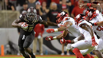 RALEIGH, NC - OCTOBER 05: Reggie Gallaspy II #25 of the North Carolina State Wolfpack runs against the Louisville Cardinals during the game at Carter Finley Stadium on October 5, 2017 in Raleigh, North Carolina. North Carolina State won 39-25. (Photo by Grant Halverson/Getty Images)