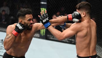 MILWAUKEE, WISCONSIN - DECEMBER 15: (L-R) Rob Font punches Sergio Pettis in their bantamweight bout during the UFC Fight Night event at Fiserv Forum on December 15, 2018 in Milwaukee, Wisconsin. (Photo by Jeff Bottari/Zuffa LLC/Zuffa LLC via Getty Images)