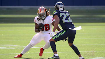 JaMycal Hasty #38 of the San Francisco 49ers against Quinton Dunbar #22 of the Seattle Seahawks (Photo by Abbie Parr/Getty Images)