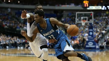 Feb 28, 2016; Dallas, TX, USA; Minnesota Timberwolves forward Andrew Wiggins (22) drives against Dallas Mavericks guard Wesley Matthews (23) at American Airlines Center. The Mavs beat the Timberwolves 128-101. Mandatory Credit: Matthew Emmons-USA TODAY Sports