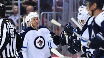 Oct 28, 2016; Denver, CO, USA; Winnipeg Jets center Shawn Matthias (16) celebrates after scoring a goal in the second period against Colorado Avalanche at Pepsi Center. Mandatory Credit: Ron Chenoy-USA TODAY Sports