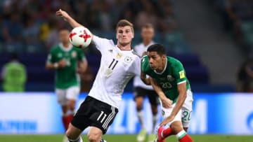 SOCHI, RUSSIA - JUNE 29: Timo Werner of Germany and Javier Aquino of Mexico compete for the ball during the FIFA Confederations Cup Russia 2017 Semi-Final between Germany and Mexico at Fisht Olympic Stadium on June 29, 2017 in Sochi, Russia. (Photo by Buda Mendes/Getty Images)