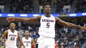 Mar 1, 2015; Hartford, CT, USA; Connecticut Huskies guard/forward Daniel Hamilton (5) reacts after his three point basket with guard Rodney Purvis (44) and guard Ryan Boatright (11) against the Southern Methodist Mustangs during the second half at XL Center. UConn defeated Southern Methodist Mustangs 81-73. Mandatory Credit: David Butler II-USA TODAY Sports