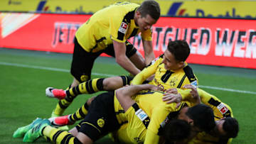 MOENCHENGLADBACH, GERMANY - APRIL 22: Raphael Guerreiro of Dortmund (C) celebrates with his team-mates after scoring his team's third goal during the Bundesliga match between Borussia Moenchengladbach and Borussia Dortmund at Borussia-Park on April 22, 2017 in Moenchengladbach, Germany. (Photo by Maja Hitij/Bongarts/Getty Images)
