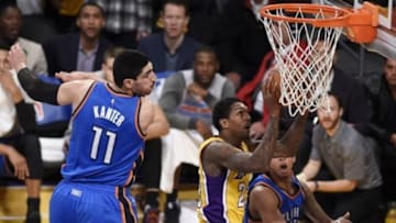 Jan 8, 2016; Los Angeles, CA, USA; Los Angeles Lakers guard Lou Williams (23) attempts a shot in front of Oklahoma City Thunder forward Enes Kanter (11) during the fourth quarter at Staples Center. The Oklahoma City Thunder won 117-113. Mandatory Credit: Kelvin Kuo-USA TODAY Sports
