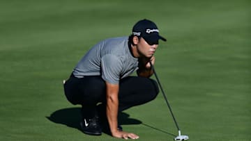 BLAINE, MINNESOTA - JULY 23: Xinjun Zhang of China looks over a putt on the tenth green during the first round of the 3M Open on July 23, 2020 at TPC Twin Cities in Blaine, Minnesota. (Photo by Stacy Revere/Getty Images)