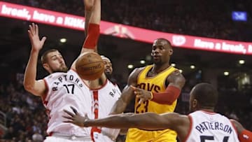Feb 26, 2016; Toronto, Ontario, CAN; Cleveland Cavaliers forward LeBron James (23) passes the ball past Toronto Raptors center Jonas Valanciunas (17) during the first half at the Air Canada Centre. Mandatory Credit: John E. Sokolowski-USA TODAY Sports