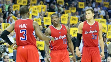 Apr 27, 2013; Memphis, TN, USA; Los Angeles Clippers guards Chris Paul (3) Eric Bledsoe (12) and forward Blake Griffin (32) talk during a timeout during game four of the first round of the 2013 NBA playoffs against the Memphis Grizzlies at the FedEx Forum. Memphis defeated Los Angeles 104-83. Mandatory Credit: Nelson Chenault-USA TODAY Sports