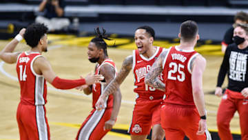 Feb 4, 2021; Iowa City, Iowa, USA; Ohio State Buckeyes guard CJ Walker (13) reacts with forward Kyle Young (25)after the game against the Iowa Hawkeyes at Carver-Hawkeye Arena. Mandatory Credit: Jeffrey Becker-USA TODAY Sports