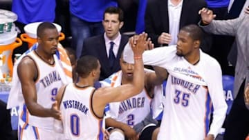 May 27, 2014; Oklahoma City, OK, USA; Oklahoma City Thunder forward Kevin Durant (35) and guard Russell Westbrook (0) high-five during the final seconds in game four of the Western Conference Finals of the 2014 NBA Playoffs at Chesapeake Energy Arena. Oklahoma City won 105-92. Mandatory Credit: Alonzo Adams-USA TODAY Sports