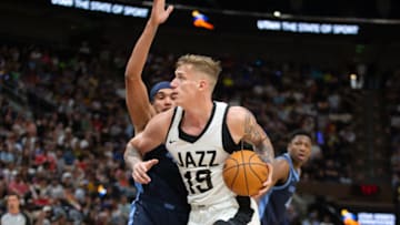 SALT LAKE CITY, UT - JULY 6: Luka Samanic #19 of the Utah Jazz drives to the basket against Timmy Allen #4 of the Memphis Grizzlies during the first half of their NBA Summer League game at the Delta Center on July 6, 2023 in Salt Lake City, Utah. NOTE TO USER: User expressly acknowledges and agrees that, by downloading and/or using this Photograph, user is consenting to the terms and conditions of the Getty Images License Agreement. (Photo by Chris Gardner/Getty Images)