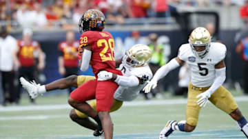 ORLANDO, FL - DECEMBER 28: Jeremiah Owusu-Koramoah #6 of the Notre Dame Fighting Irish tackles Breece Hall #28 of the Iowa State Cyclones in the first half of the Camping World Bowl at Camping World Stadium on December 28, 2019 in Orlando, Florida. (Photo by Joe Robbins/Getty Images)