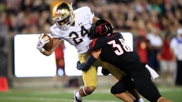 LOUISVILLE, KENTUCKY - SEPTEMBER 02: Tommy Tremble #24 of the Notre Dame Fighting Irish reaches for a touchdown against the Louisville Cardinals on September 02, 2019 in Louisville, Kentucky. (Photo by Andy Lyons/Getty Images)