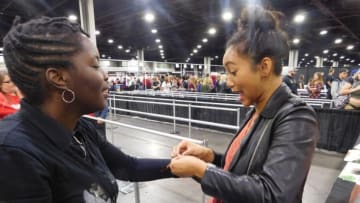 Tameche Brown receives a friendship bracelet from actor Sydney Park at Walker Stalker Con Atlanta 2017Photo credit: Tracey Phillipps
