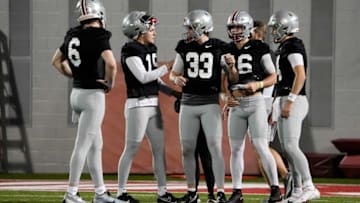 Mar 7, 2023; Columbus, Ohio, USA; Ohio State Buckeyes quarterbacks, from left, Kyle McCord, Chad Ray, Devin Brown, Mason Maggs and Tristan Gebbia talk during spring football drills at the Woody Hayes Athletic Center. Mandatory Credit: Adam Cairns-The Columbus DispatchFootball Ohio State Buckeyes Football
