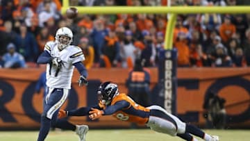 Jan 3, 2016; Denver, CO, USA; San Diego Chargers quarterback Philip Rivers (17) throws a pass under pressure from Denver Broncos outside linebacker Von Miller (58) during the second half at Sports Authority Field at Mile High. The Broncos won 27-20. Mandatory Credit: Chris Humphreys-USA TODAY Sports