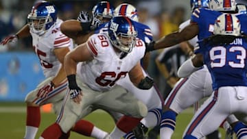 Aug 3, 2014; Canton, OH, USA; New York Giants center Weston Richburg (60) against the Buffalo Bills in the 2014 Hall of Fame game at Fawcett Stadium. Mandatory Credit: Kirby Lee-USA TODAY Sports