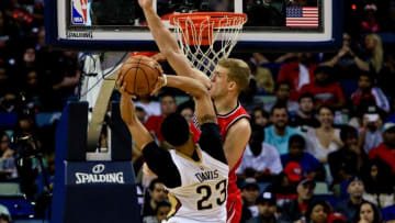 Mar 18, 2016; New Orleans, LA, USA; New Orleans Pelicans forward Anthony Davis (23) shoots as Portland Trail Blazers center Mason Plumlee (24) defends during the second quarter of a game at the Smoothie King Center. Mandatory Credit: Derick E. Hingle-USA TODAY Sports