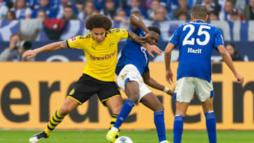 GELSENKIRCHEN, GERMANY - OCTOBER 26: Axel Witsel of Borussia Dortmund and Rabbi Matondo of FC Schalke 04 battle for the ball during the Bundesliga match between FC Schalke 04 and Borussia Dortmund at Veltins-Arena on October 26, 2019 in Gelsenkirchen, Germany. (Photo by TF-Images/Getty Images)