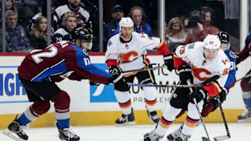 Dec 27, 2016; Denver, CO, USA; Calgary Flames center Sam Bennett (93) controls the puck as Colorado Avalanche right wing Jarome Iginla (12) defends in the first period at the Pepsi Center. Mandatory Credit: Isaiah J. Downing-USA TODAY Sports