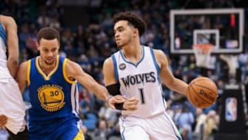 Nov 12, 2015; Minneapolis, MN, USA; Minnesota Timberwolves guard Tyus Jones (1) dribbles in the fourth quarter against the Golden State Warriors guard Stephen Curry (30) at Target Center. The Golden State Warriors beat he Minnesota Timberwolves 129-116. Mandatory Credit: Brad Rempel-USA TODAY Sports