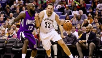 Jan 28, 2016; New Orleans, LA, USA; New Orleans Pelicans forward Ryan Anderson (33) dribbles the ball around Sacramento Kings forward Quincy Acy (13) during the second half at the Smoothie King Center. The Pelicans won 114-105. Mandatory Credit: Derick E. Hingle-USA TODAY Sports