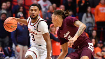 Dec 17, 2022; Champaign, Illinois, USA; Illinois Fighting Illini guard Jayden Epps (3) drives the ball to the basket against Alabama A&M Bulldogs guard Dailin Smith (15) during the first half at State Farm Center. Mandatory Credit: Ron Johnson-USA TODAY Sports